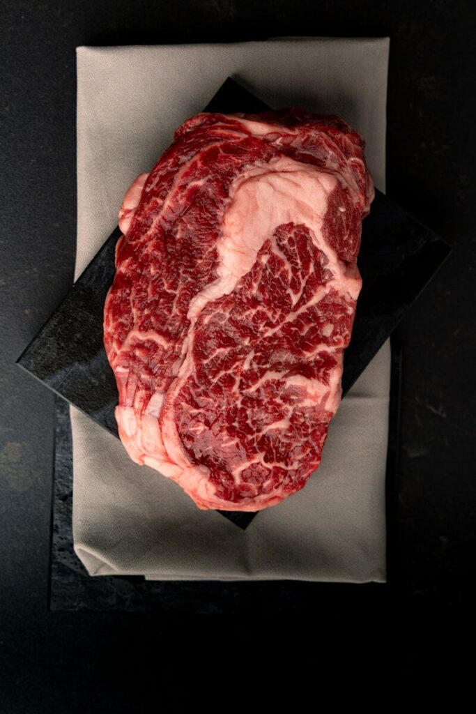 A piece of meat sitting on top of a piece of paper